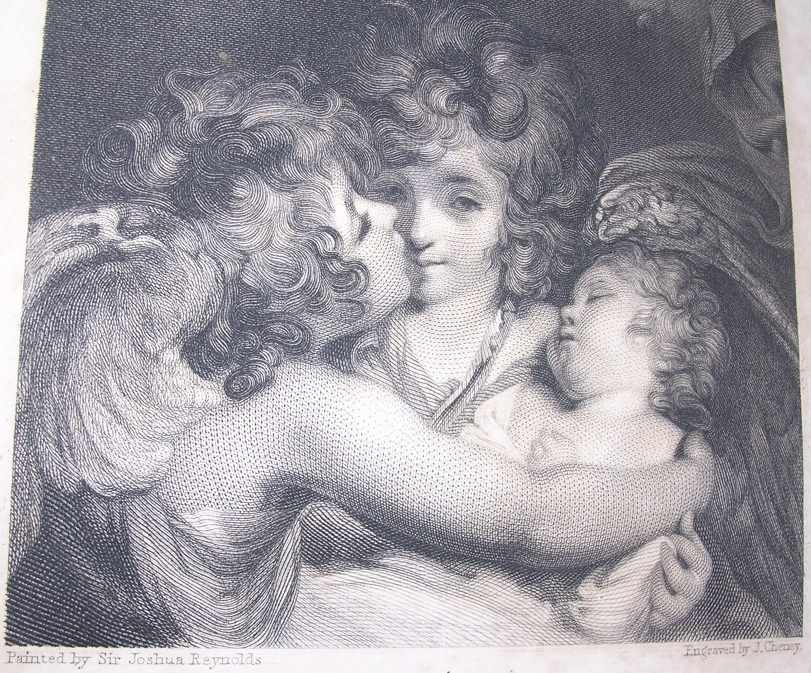 a cherub embraces a white woman holding a sleeping baby