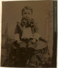 tintype of boy wearing a bow