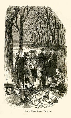 people gathered around a fire in the snow
