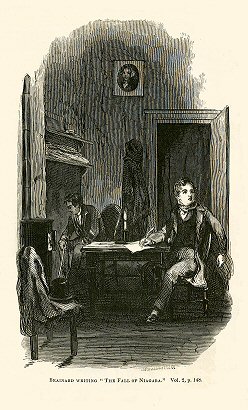 a man writes at a table